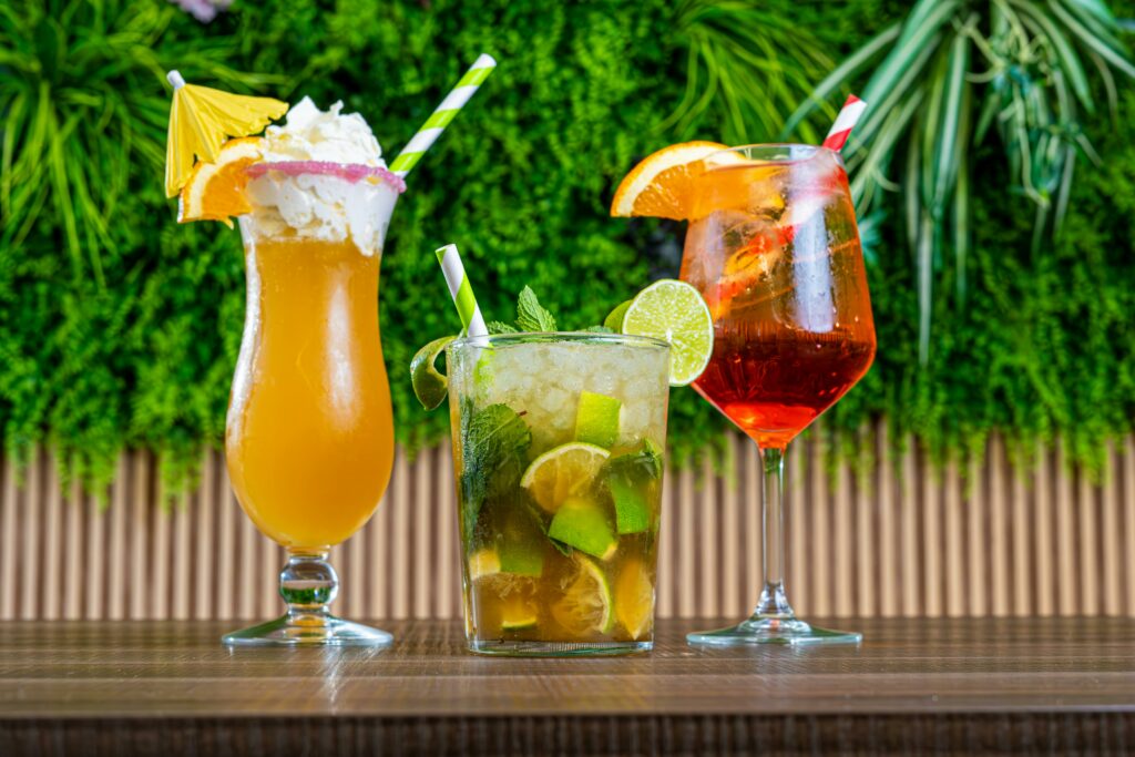 Vibrant tropical cocktails with citrus fruits, perfect for summer enjoyment.